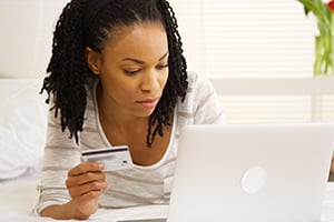 woman making debit purchase online