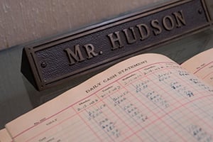 ledger and nameplate for Mr. Hudson