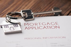 mortgage application with key on top