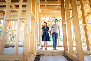 Couple looking at house frame