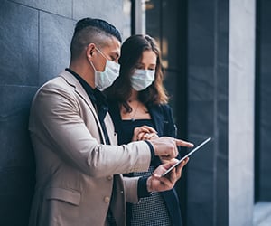 business professionals working together wearing masks: professional services