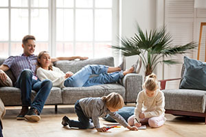 family relaxing in vacation home