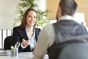 banker helping client set up checking account