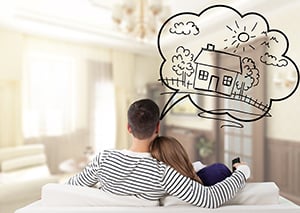 couple on sofa with home thought bubble