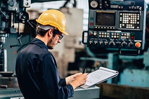 business owner evaluating equipment
