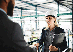 business woman shaking hands during business construction