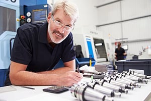 smiling businessman with equipment