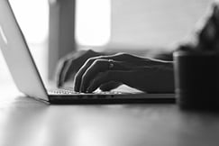 blackandwhite-hands typing on laptop