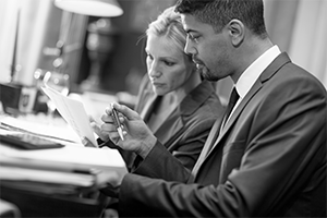 man and woman working on legal paperwork