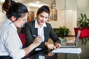 professional women working on legal paperwork