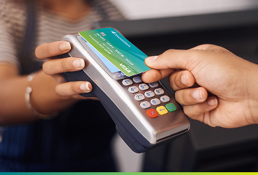 Person using Seacoast Visa Debit Card to pay