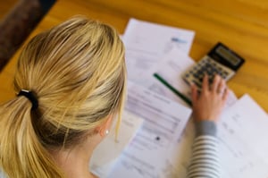 bigstock-a-woman-with-unpaid-bills-has--61188815_600x