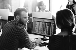 Business man and woman working on a computer