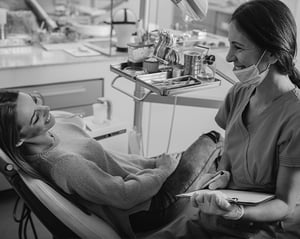 woman dentist working with woman patient
