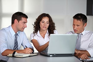 business professionals working on laptop