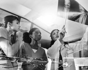 women doctor and nurses reviewing xray