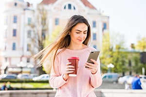 woman on home with holiday coffee