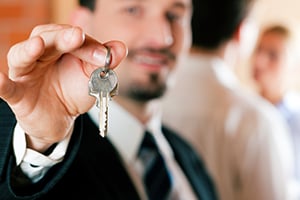 Man holding keys to new home