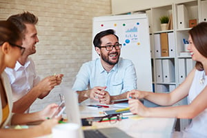 Happy employees at a small business meeting