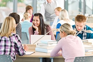 smiling group of students in a library