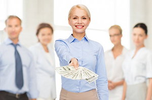 commercial business woman holding out money