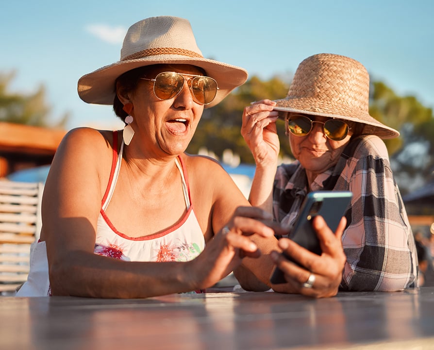 894x720-senior-ladies-looking-at-phone-final