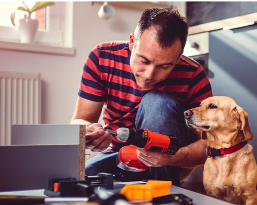 Man with tools and dog