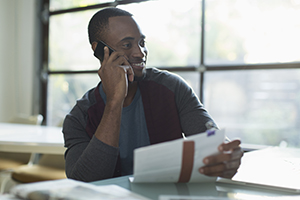 man on the phone discussing debt reduction